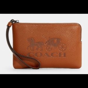 Refined pebble leather
Two credit card slots
Zip-top closure,